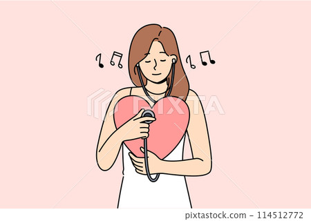 Woman listens to own heart using stethoscope to maintain spiritual harmony and psychological health Woman listens to own heart using stethoscope to maintain spiritual harmony and psychological health 114512772