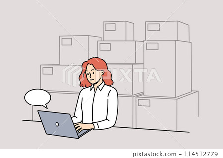 Woman small business owner works sitting near computer and boxes, selling goods through online store 114512779