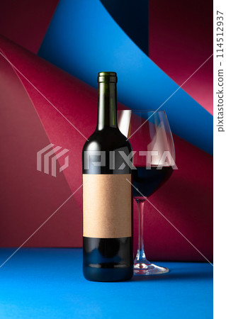 Bottle and glass of red wine. Bottle and glass of red wine. 114512937