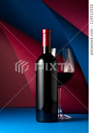 Bottle and glass of red wine. Bottle and glass of red wine. 114512938