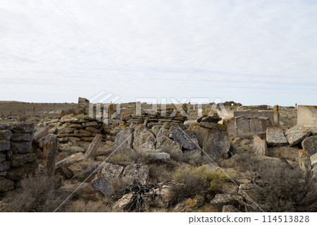 Desolate graveyard in remote location in Mangystau region, Kazakhstan 114513828