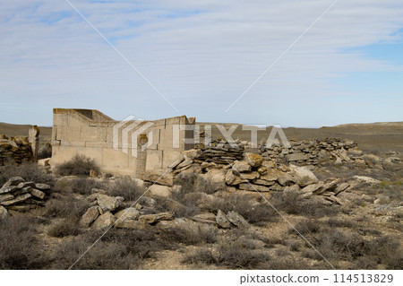 Desolate graveyard in remote location in Mangystau region, Kazakhstan 114513829