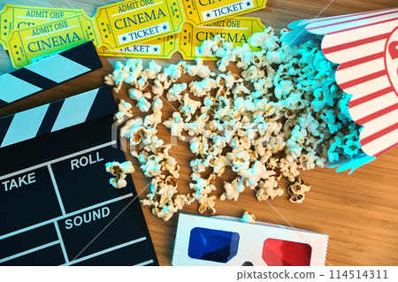 Cinema clapperboard, popcorn, tickets and 3d glasses 114514311