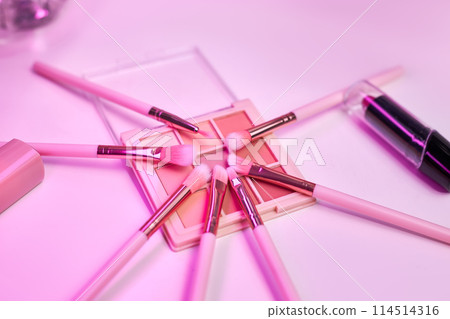 Background with decorative cosmetics on dressing table in makeup room Background with decorative cosmetics on dressing table in makeup room 114514316