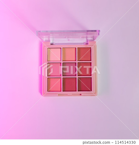 Eye shadow of nude shades palette swatches on pink background 114514330