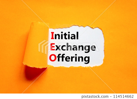 IEO initial exchange offering symbol. Concept words IEO initial exchange offering on beautiful paper. Beautiful orange paper background. Business IEO initial exchange offering concept. Copy space. 114514662