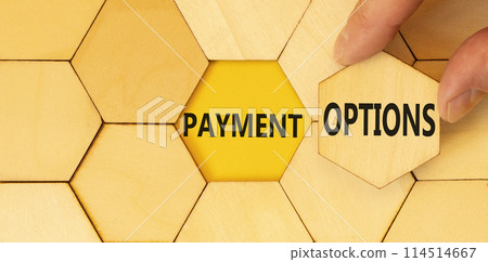 Payment options symbol. Concept words Payment options on beautiful wooden puzzles. Beautiful yellow background. Businessman hand. Business payment options concept. Copy space. Payment options symbol. Concept words Payment options on beautiful wooden puzzles. Beautiful yellow background. Businessman hand. Business payment options concept. Copy space. 114514667