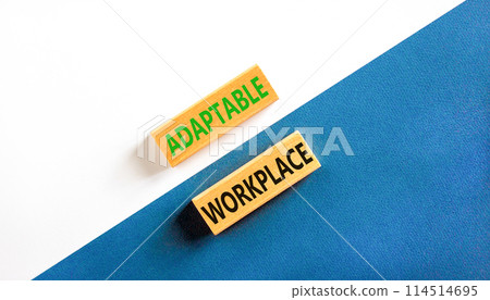 Adaptable workplace symbol. Concept words Adaptable workplace on beautiful wooden block. Beautiful blue and white paper background. Business Adaptable workplace concept. Copy space. 114514695