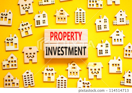 Property investment symbol. Concept words Property investment on beautiful wooden blocks. Wooden model of houses. Beautiful yellow background. Business Property investment concept. Copy space. Property investment symbol. Concept words Property investment on beautiful wooden blocks. Wooden model of houses. Beautiful yellow background. Business Property investment concept. Copy space. 114514713