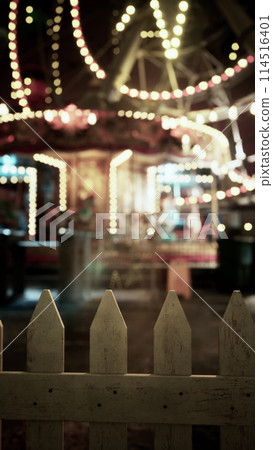 Blurry Carnival Ride Illuminated at Night Blurry Carnival Ride Illuminated at Night 114516401