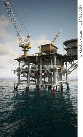 Old Oil Rig Operating in the Ocean 114516587