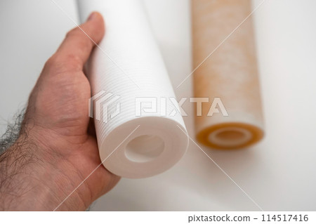 Close up new water filters. Replacement of dirty filters for water filtration by reverse osmosis. Close up new water filters. Replacement of dirty filters for water filtration by reverse osmosis. 114517416