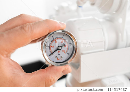 Pressure gauge shows the pressure in the reverse osmosis system. Pressure gauge shows the pressure in the reverse osmosis system. 114517487