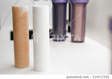New and used filter cartridges for water purification in reverse osmosis system for home use in the kitchen 114517592