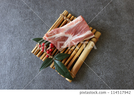 Raw pork loin on a grey background Raw pork loin on a grey background 114517942