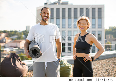 Portrait of happy family doing sports in summer against urban landscape. Portrait of happy family doing sports in summer against urban landscape. 114518320