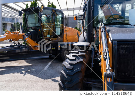 Fleet of yellow construction machines Fleet of yellow construction machines 114518648