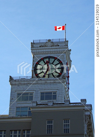 Clock tower with flying Canadian flog on a historic building in Vancouver, Canada Clock tower with flying Canadian flog on a historic building in Vancouver, Canada 114519019