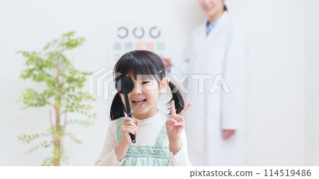 Child having eyesight test at eye clinic Child having eyesight test at eye clinic 114519486