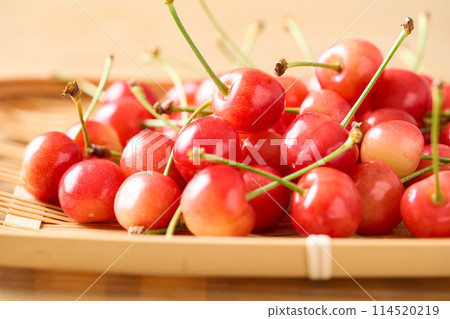 Cherries (Sato Nishiki from Yamagata Prefecture) served in a colander 114520219