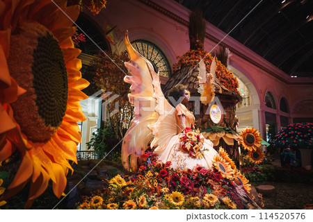 Colorful indoor fantasy display in Las Vegas with sunflowers, fairy figure, treehouse, and whimsical details. Perfect for enchanting and imaginative escapes. Colorful indoor fantasy display in Las Vegas with sunflowers, fairy figure, treehouse, and whimsical details. Perfect for enchanting and imaginative escapes. 114520576
