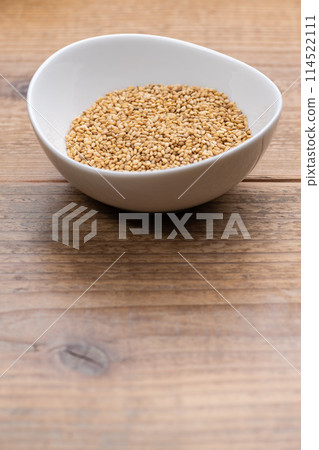 Sesame seeds on a small plate Sesame seeds on a small plate 114522111
