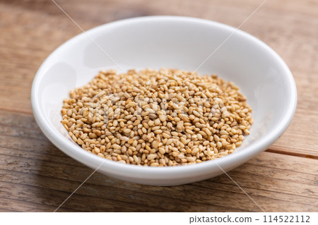 Sesame seeds on a small plate Sesame seeds on a small plate 114522112