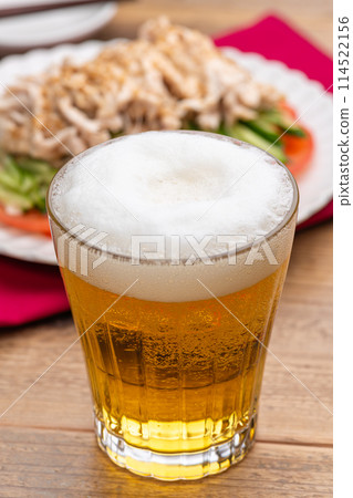 Beer in a glass and Bang Bang Chicken 114522156