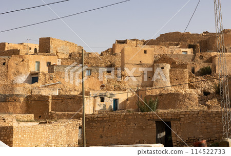 Ancient Berber hillside village in governorate of Gabes, Tunisia Ancient Berber hillside village in governorate of Gabes, Tunisia 114522733