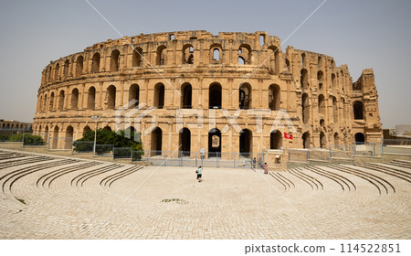 Ancient El Jem Amphitheatre under clear blue Tunisian sky 114522851