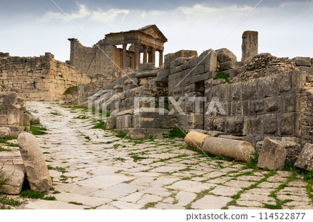 Ruins of ancient Roman capitol on territory of antic city of Dougga in area of modern Tunisia. 114522877