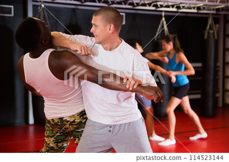 Two man training captures on self-defense course Two man training captures on self-defense course 114523144