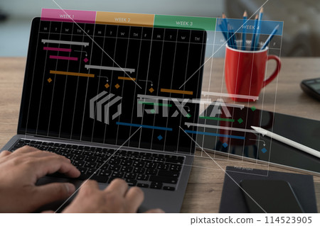 Project manager leading the computer interface update chart scheduling Project on the research and development process 114523905