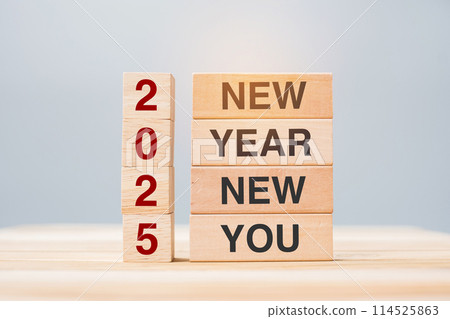hand holding wooden block with text 2025 NEW YEAR NEW YOU on table background. Resolution, strategy, goal, business and holiday concepts 114525863