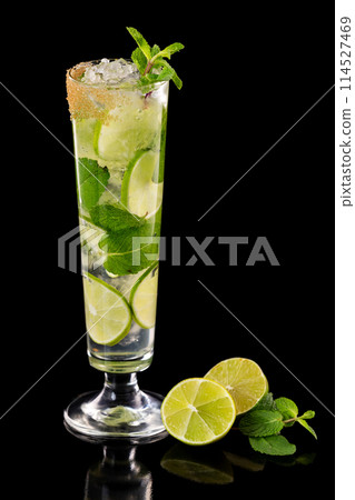 Closeup glass of fresh mojito cocktail with mint and lime isolated at black background. 114527469