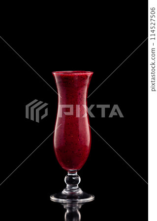 Glass of red strawberry fresh shake isolated at black background. Glass of red strawberry fresh shake isolated at black background. 114527506