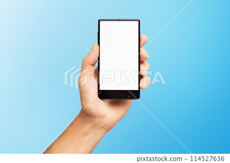 Mockup of male hand holding black frameless cell phone with blank screen isolated at blue background. 114527636