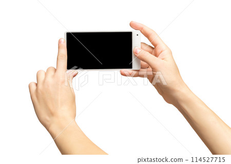 Mockup of female hands holding frameless cellphone with black screen and making selfie at isolated background. Mockup of female hands holding frameless cellphone with black screen and making selfie at isolated background. 114527715