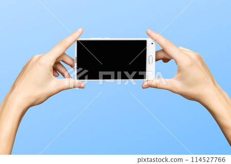 Female hands holding modern mobile phone 114527766