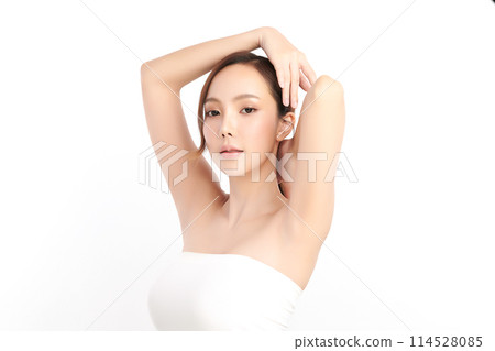 Beautiful Young Asian woman lifting hands up to show off clean and hygienic armpits or underarms on white background, Smooth armpit cleanliness and protection concept 114528085