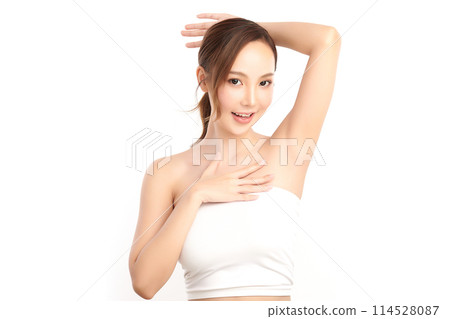 Beautiful Young Asian woman lifting hands up to show off clean and hygienic armpits or underarms on white background, Smooth armpit cleanliness and protection concept Beautiful Young Asian woman lifting hands up to show off clean and hygienic armpits or underarms on white background, Smooth armpit cleanliness and protection concept 114528087