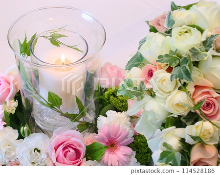 Pink roses and candle petals 114528186