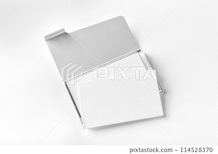 Mock-up of opened metal card holder with business cards stack isolated at textured paper background. 114528370