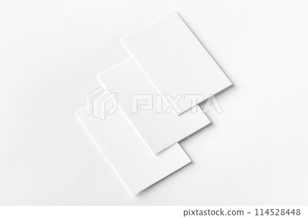 Mockup of three vertical business cards at white textured background. Mockup of three vertical business cards at white textured background. 114528448