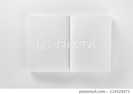 Mockup of opened blank book at white design paper background. Mockup of opened blank book at white design paper background. 114528471
