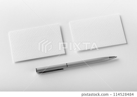 Mockup of two horizontal business cards and pen at white textured background. 114528484