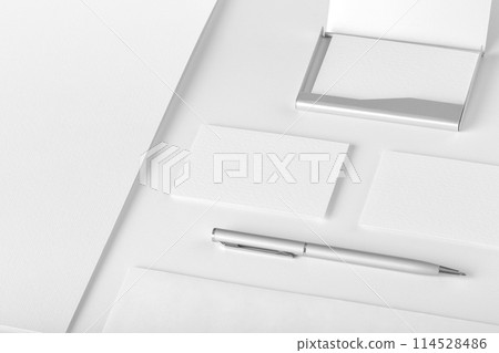 Corporate stationery mockup. Presentation folder, envelope and business cards at white textured background. 114528486