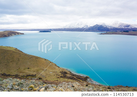 Lake Tekapo landscape under cloudy skies Lake Tekapo landscape under cloudy skies 114530713