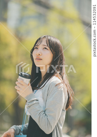 A young office lady taking out hot coffee A young office lady taking out hot coffee 114532091