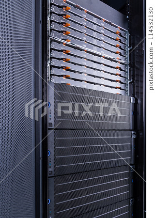server rack with uncovered data storage arrays filled with hard drives - internet cloud provider concept 114532130
